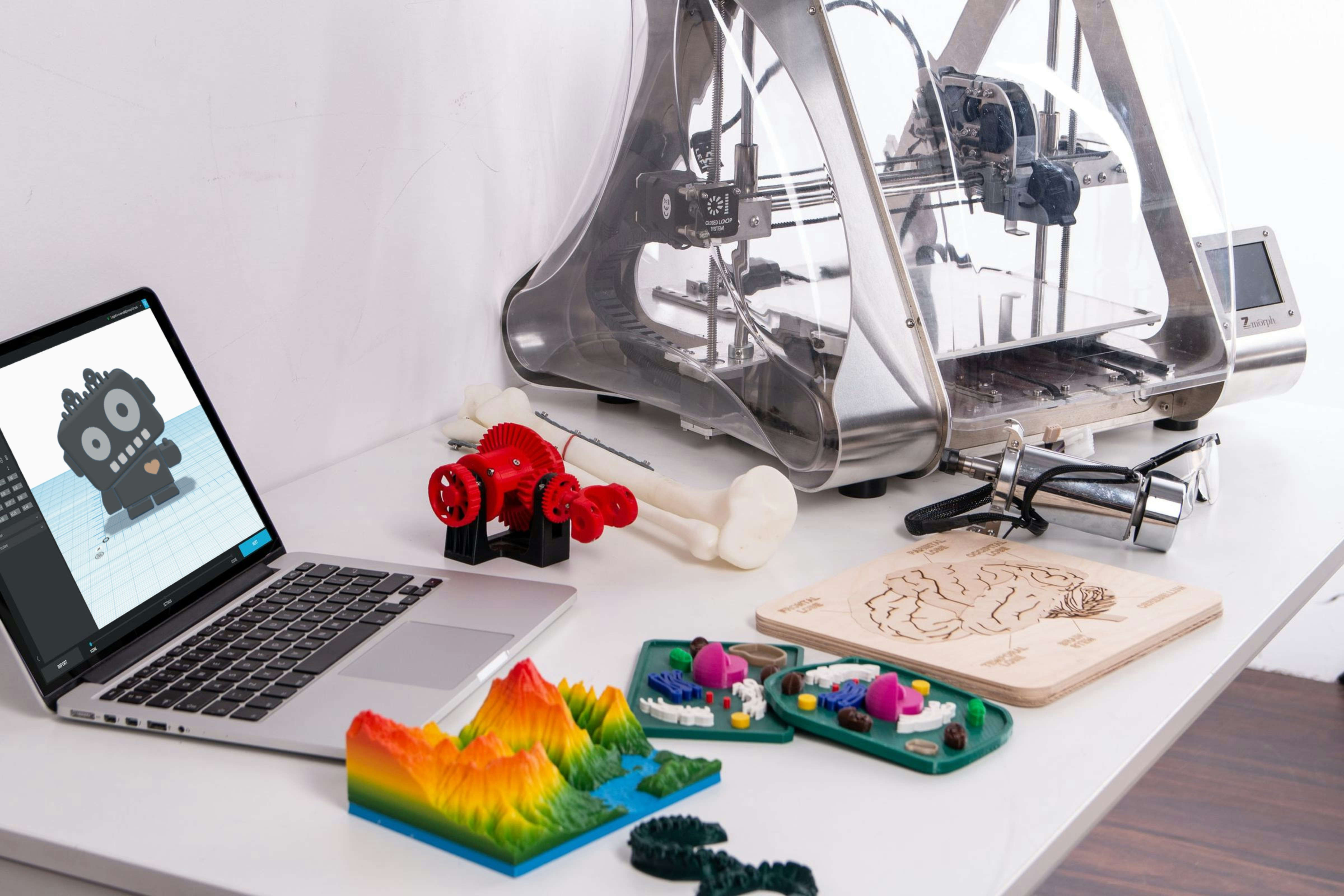 Operator inspecting a part in front of a 3D printer